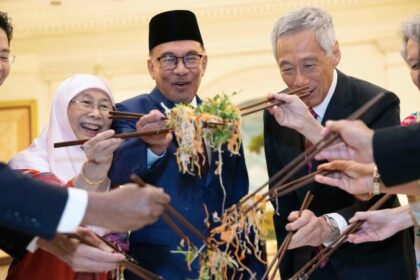 A food fight with chopsticks? How "Toss of Prosperity" has become one of the most fun culinary traditions of the New Year of the Moon