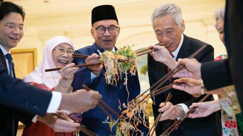 A food fight with chopsticks? How "Toss of Prosperity" has become one of the most fun culinary traditions of the New Year of the Moon